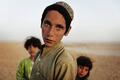 Afghan children stand together near the town of Kunjak in southern Afghanistan's Helmand province